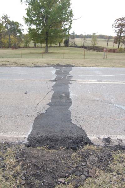A 2011 magnitude 5.7 quake near Prague, Okla., apparently triggered by wastewater injection, buckled US Highway 62. Credit: John Leeman