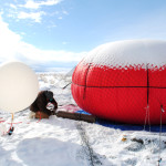 National Oceanic and Atmospheric Administration researcher Bryan Johnson (left) and University of Colorado Boulder researcher Detlev Helmig set up a tethered balloon to collect air samples above Utah’s Uintah Basin. Photo credit: Chelsea Thompson, via Chemical & Engineering News