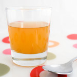 A glass of raw, unfiltered apple cider vinegar, with 