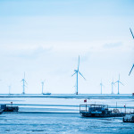 Wind power farm near Yancheng seashore in China. Photo courtesy of Shutterstock